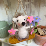 Adorable Little Swinging Hedgehog