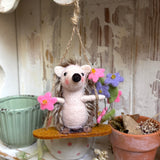 Adorable Little Swinging Hedgehog
